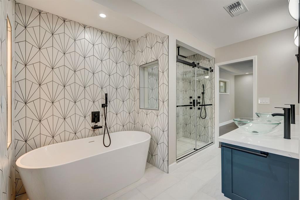 Have a self-care, spa day in your own private retreat with this roomy shower and soaking tub.