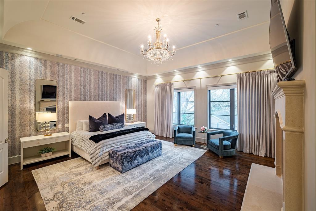 The primary suite also feature gorgeous designer wall papers, tray ceiling and beautiful chandelier. Throughout the home is the sprinkler system and Smart Home automation system.