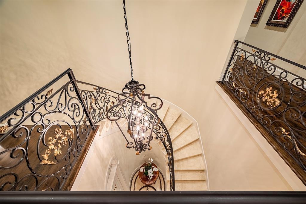 Leading upstairs, you will be welcoming by this  gorgeous wrought iron spiral staircase that lead you to the spacious second floor landing.