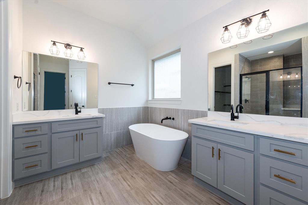 Master Bathroom features two separate sinks and a beautiful tub