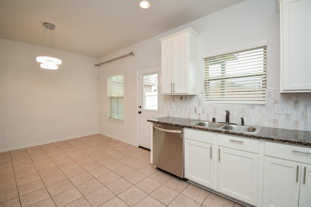 The spacious corner, left, is the perfect spot for a breakfast/casual dining nook, with nice natural light and handy patio door.