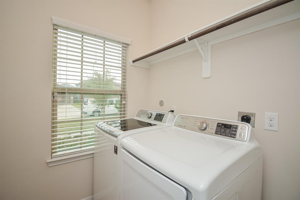 A big window is a nice feature in your Laundry room, which easily accommodates dual appliances. WASHER & DRYER will Stay!