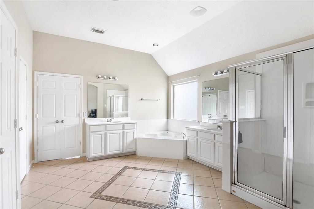 Another view of this Spacious Primary with Hollywood Vanity Lights, and Vaulted ceilings, & recessed overhead lighting! Spa Day anyone?
