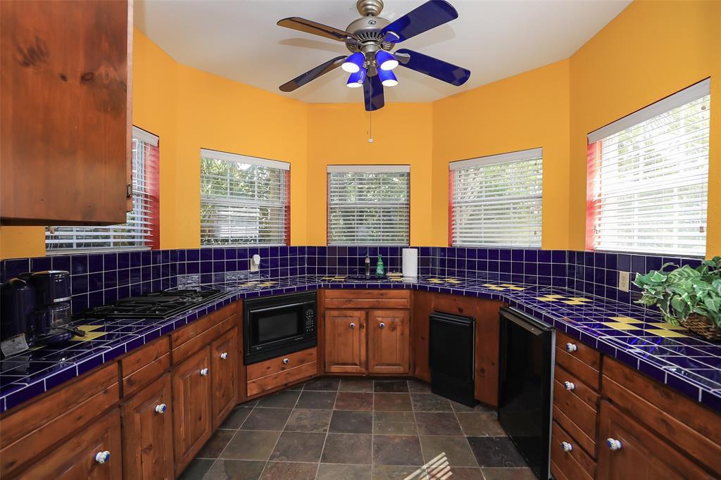 The well appointed kitchen in the pool house...It has it all with the exception of an oven!