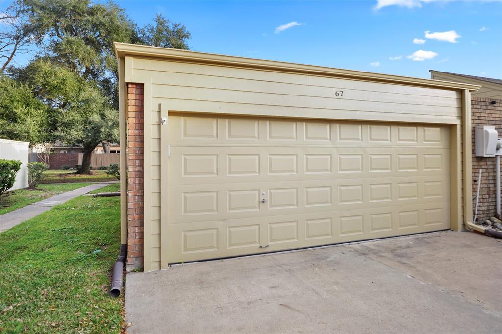 2-car garage, detached from home but connected with covered breezeway.