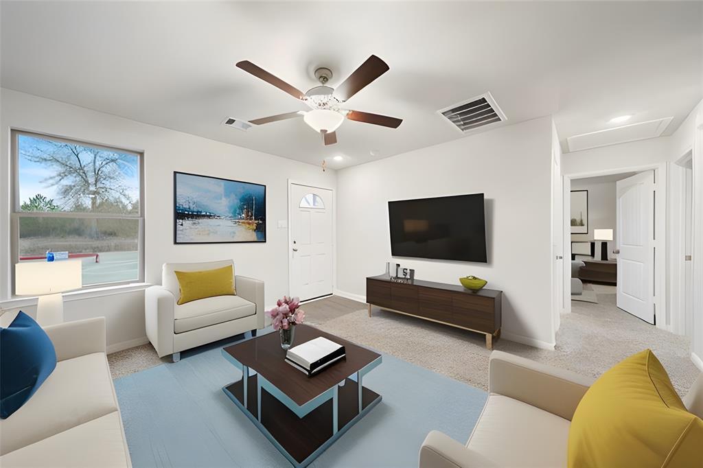 Virtually staged family room w/ plush neutral carpet, a ceiling fan, and open layout.