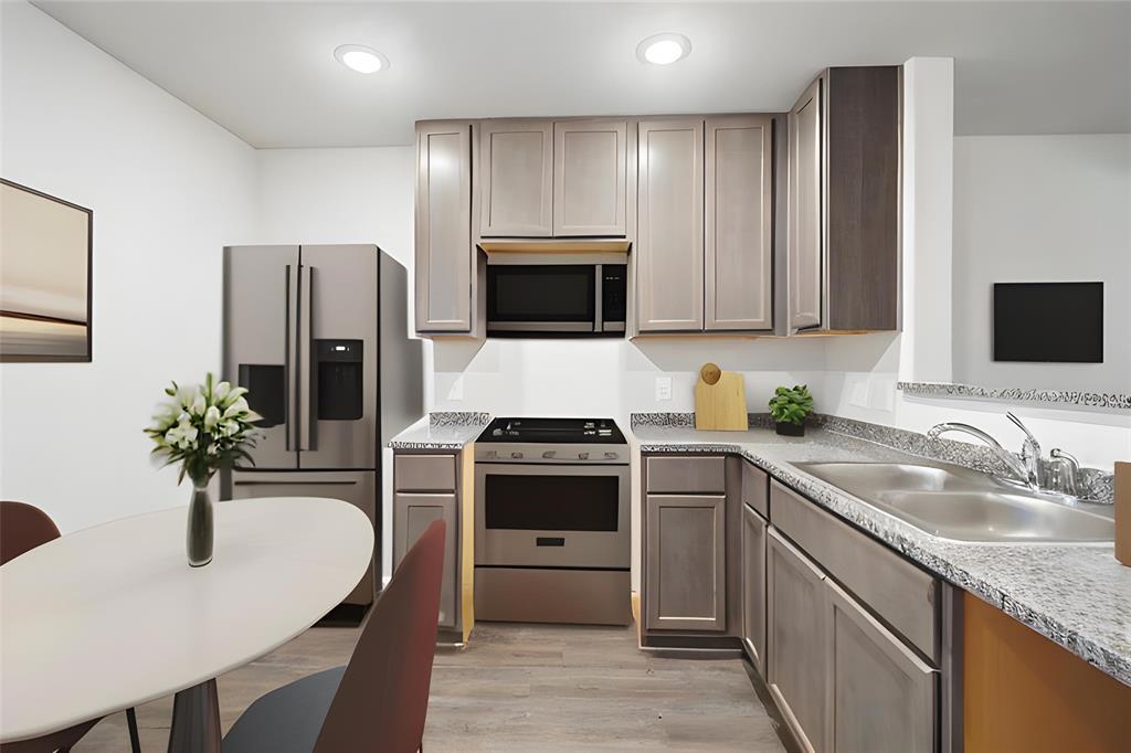 Virtually staged kitchen, including virtual appliances.