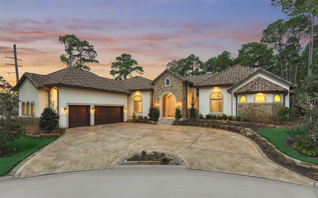 This exceptional home offers a stone and stucco elevation and is surrounded by meticulously kept grounds.