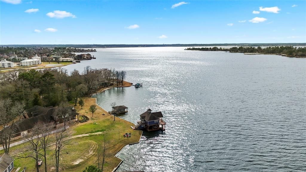 Lot boasts 262 feet of frontage and gorgeous open water views of Lake Conroe.