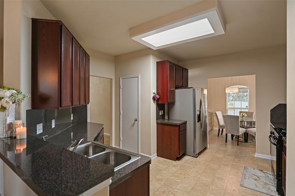 Open concept living at its best with the Kitchen open to the Breakfast Room, Family Room, and Dining Rooms.