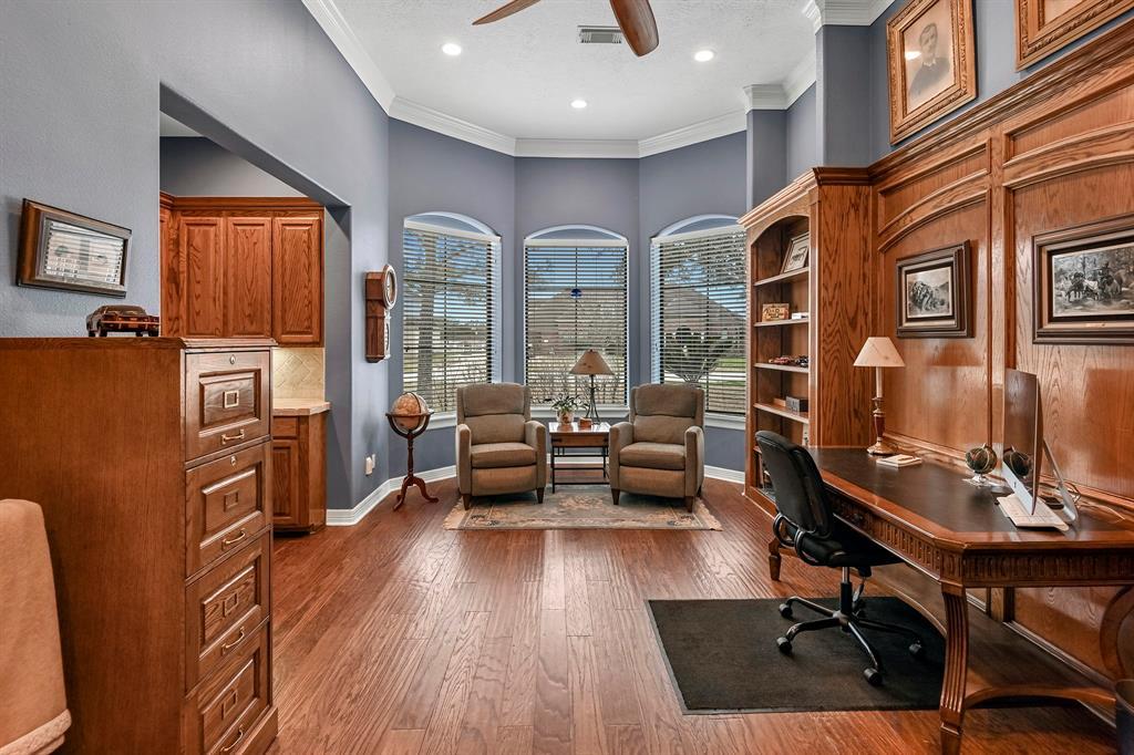 Gorgeous office/library with wet bar and TV