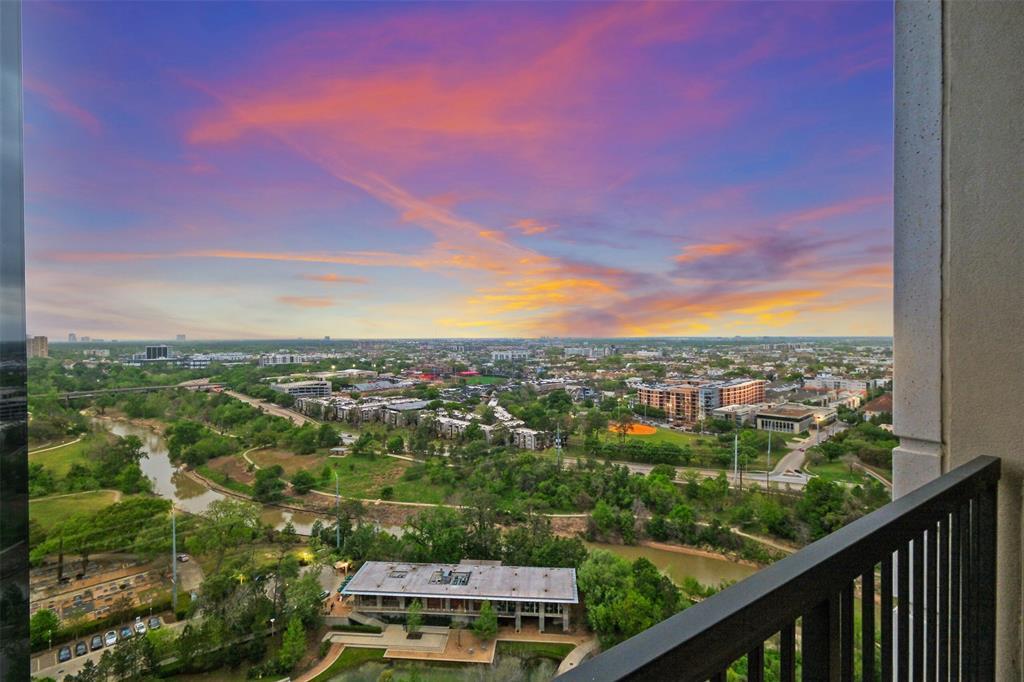 Enjoy picturesque Buffalo Bayou linear park from your primary suite balcony.