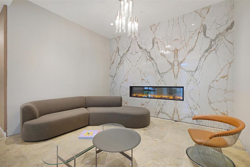 Newly renovated lobby with luxury appeal in this sitting area highlighted by a modern recessed fireplace.