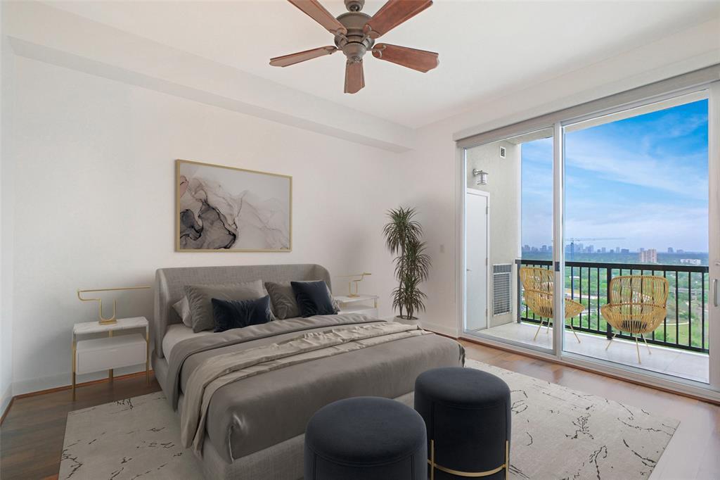 Sizeable secondary bedroom features hardwood flooring and a balcony.