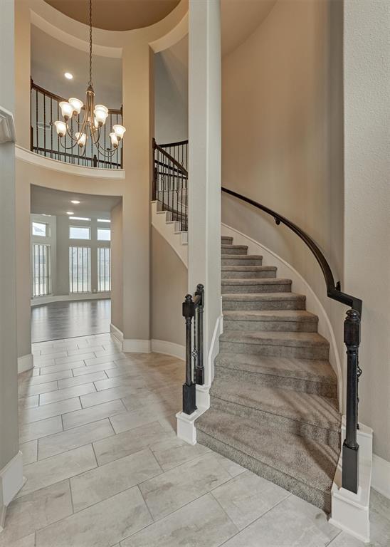 Westin Homes' signature curved, wrought iron staircase is a stylish touch.