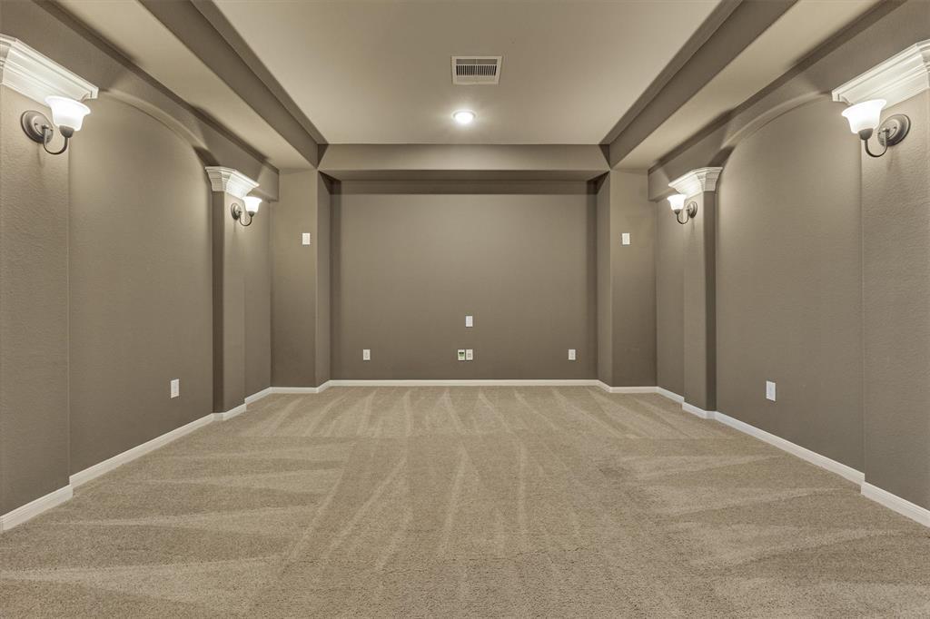 Media room with sconce lighting is perfect for entertaining!
