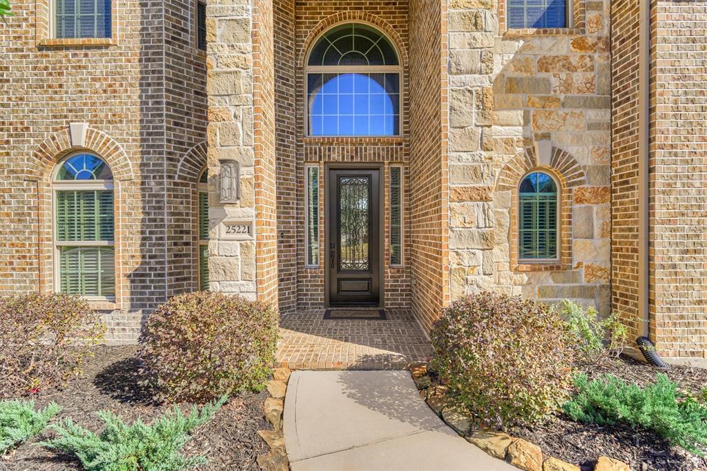 Open sight lines greet you from the moment you step inside. Attractive architectural details such as the curved, wrought-iron staircase, arched doorways and custom millwork flow throughout this home.
