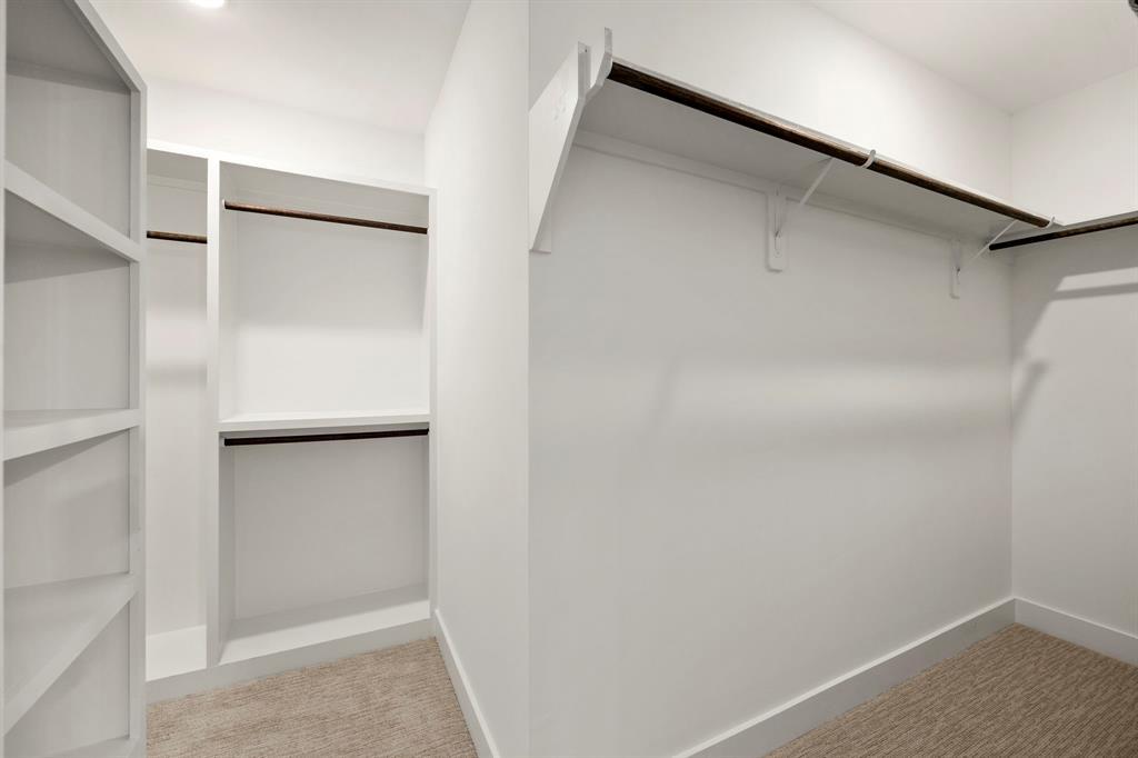 Large Primary Walk-In Closet with Separate Closet Space For Two