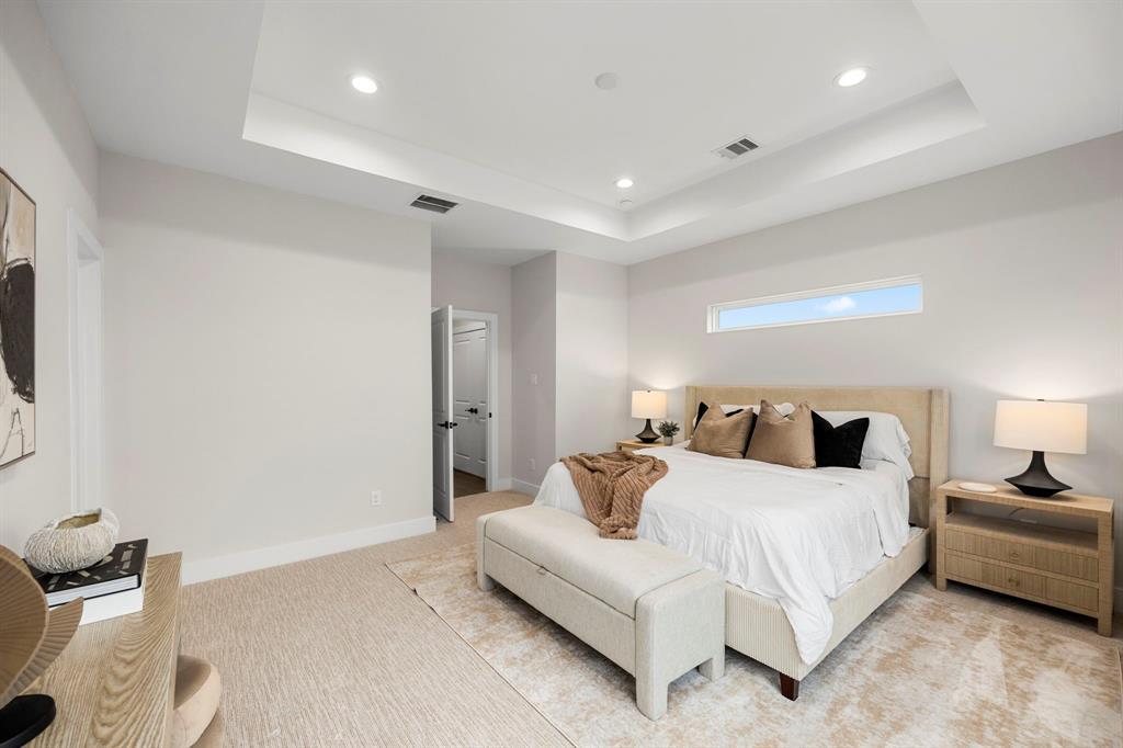 Incredible Primary Bedroom with Recessed LED Lighting, Room For Vanity, and Lounge Seating