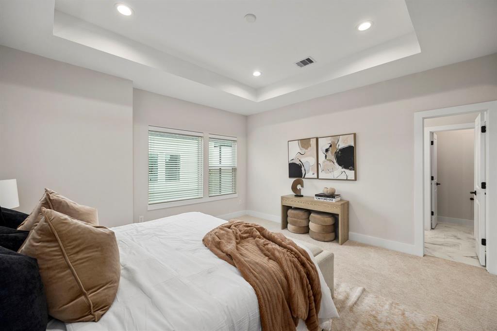 Incredible Primary Bedroom with Recessed LED Lighting, Room For Vanity, and Lounge Seating