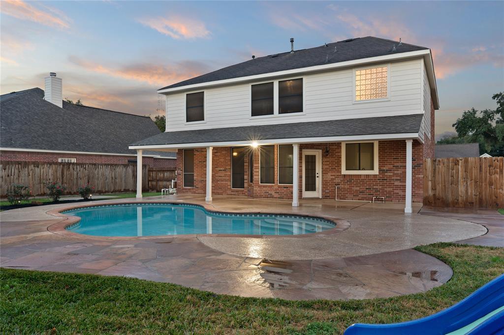 Come and see this spacious backyard with its beautiful covered patio and private oasis. There is plenty of room for the kids to play and adults to relax!