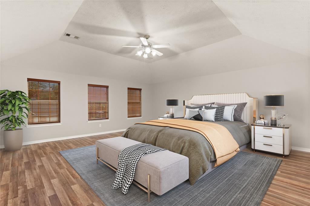 What a wonderful place to come home to, this stunning primary suite greets you with gorgeous flooring, custom paint, high ceiling, ceiling fan with lighting, lovely windows with blinds allowing in natural light brightening up this spacious primary bedroom, with extra space for a seating area.