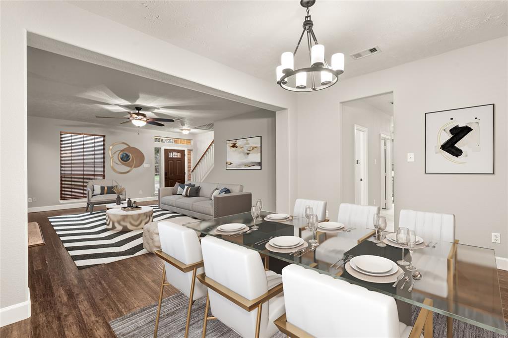 Make memories gathered around the table with your family and friends! This dining room features high ceilings, easy access to the kitchen and family room and a beautiful chandelier.