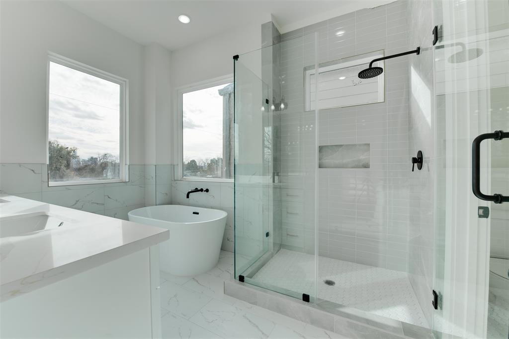 Master bedroom shower and bathroom tub.
