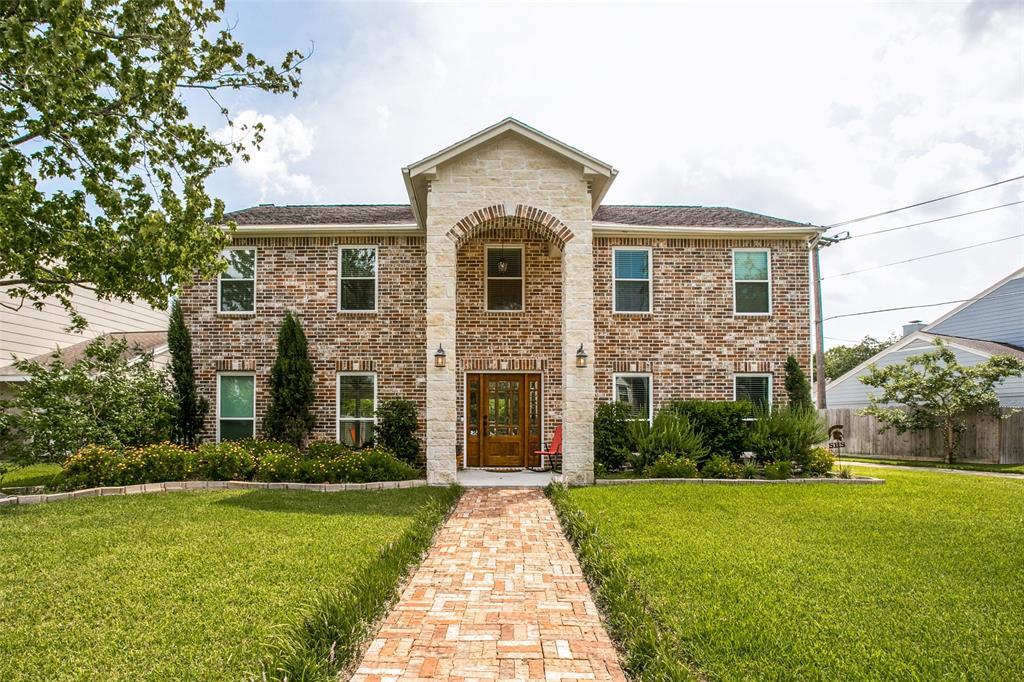 Mature landscaping, great curb appeal, stone and brick elevation, located across the street from Terry Hershey Park!