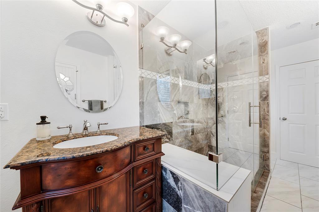 The primary bath was fully updated with an oversized shower, double vanities and sinks.
