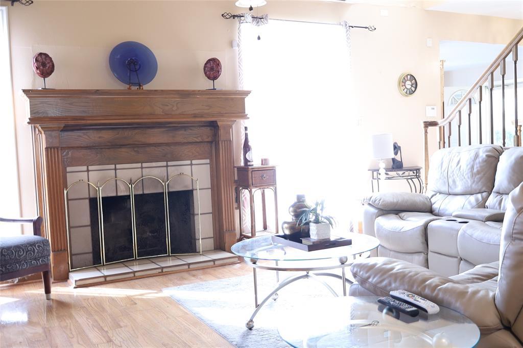 Spacious living room with original hardwood floors