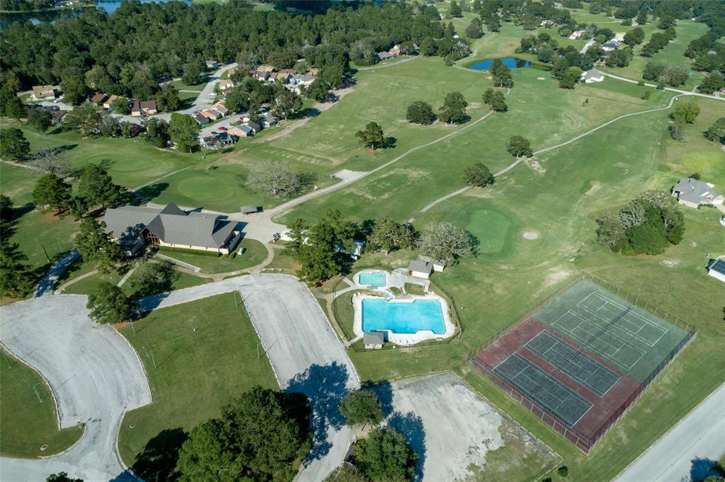 Overview of the main club house, tennis courts and one of the three pool areas.
